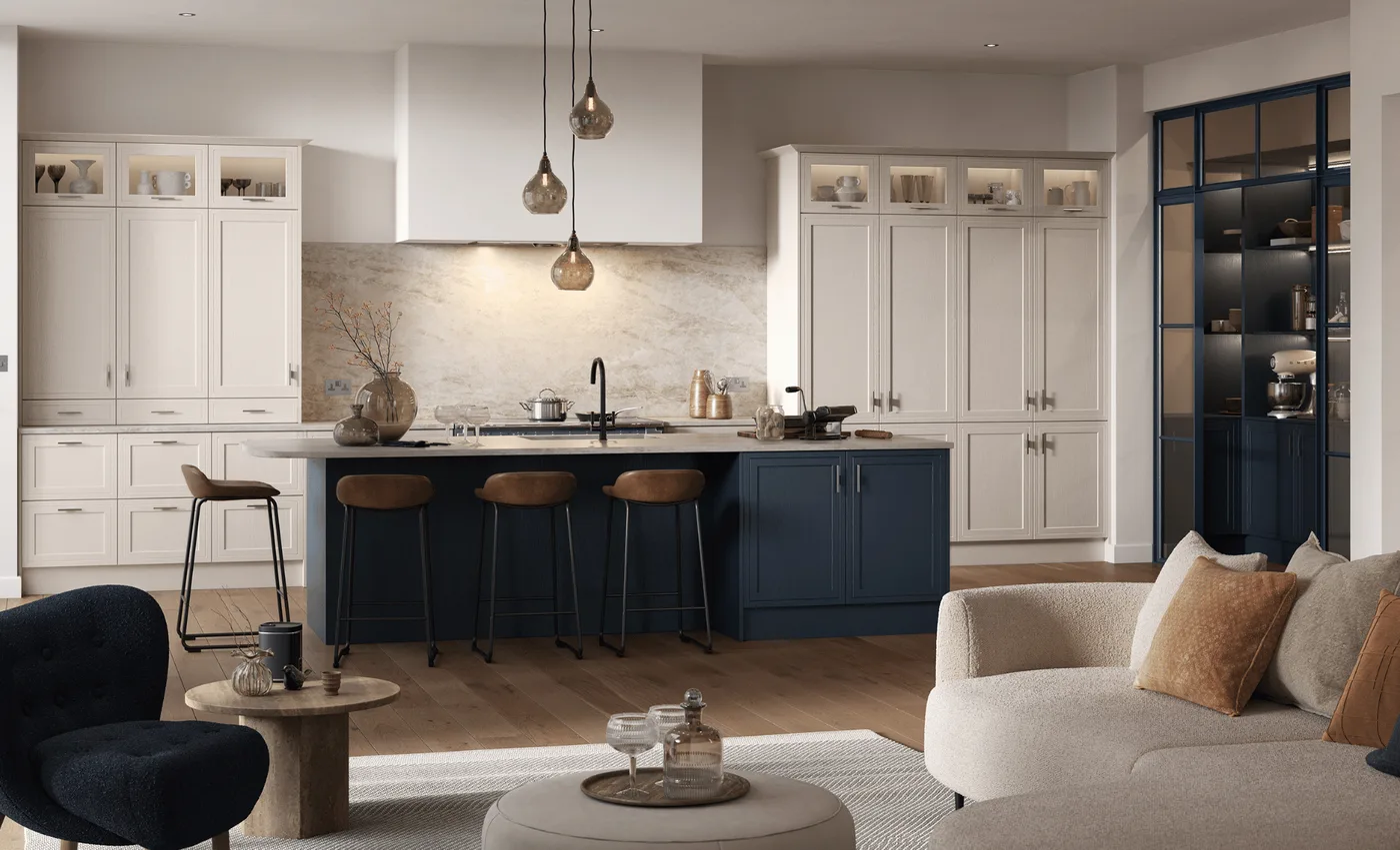 An ash painted kitchen in chalk cliffs with a sumburgh midnight island, bar stools and a glazed larder cabinet