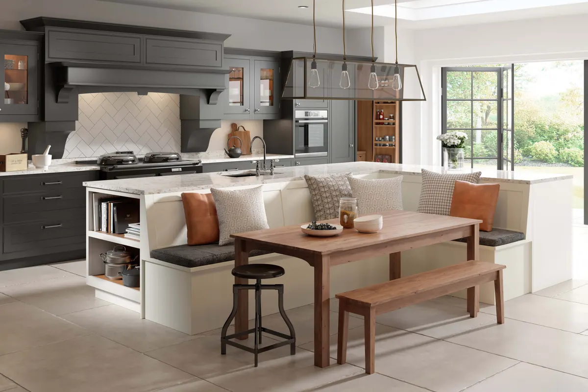 Off-white shaker island with built-in bench seating