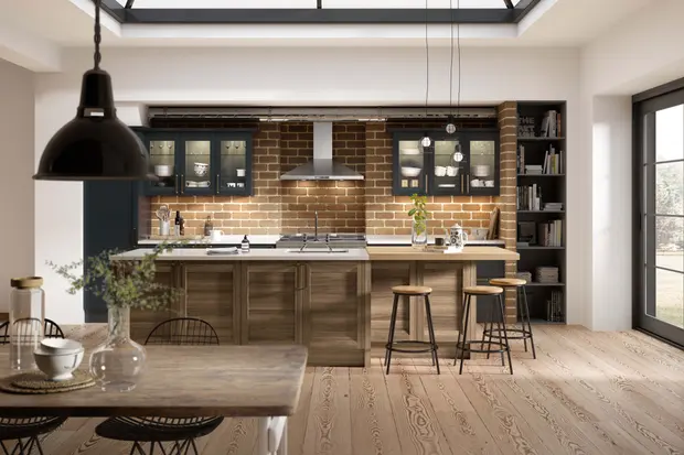 Deep green and walnut cabinets with exposed brick splashback