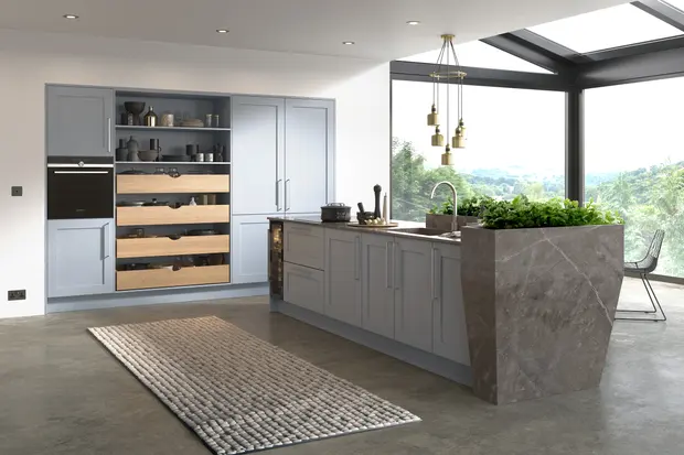 Pale blue cabinets with open oak drawers